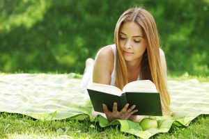 Young woman reading book